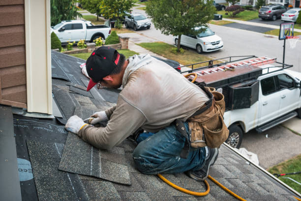 Professional Roofing technician working in Middle Village, NY